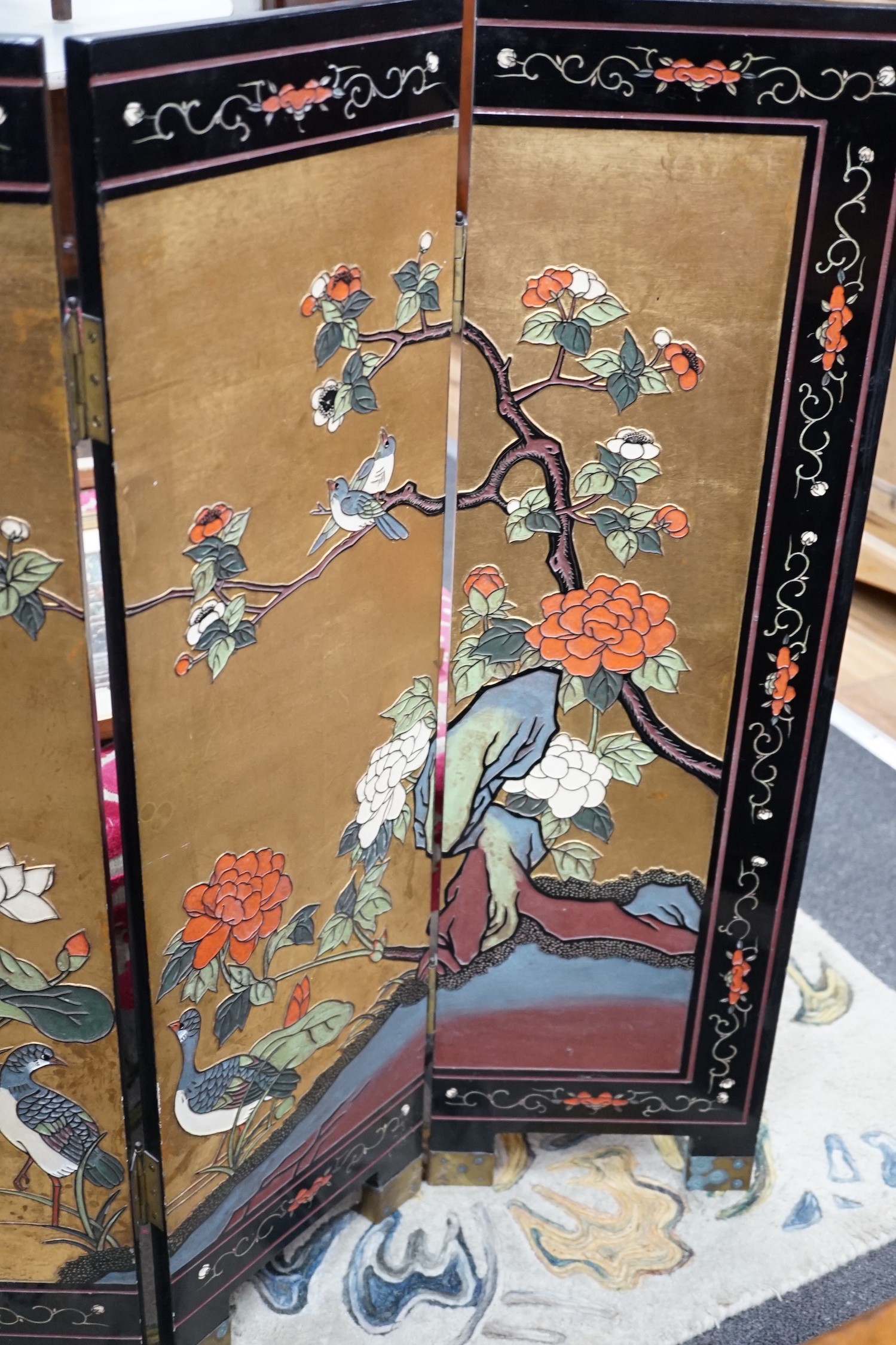 A Chinese ‘coromandel’ lacquer low four fold screen, height 92cm *Please note the sale commences at 9am.